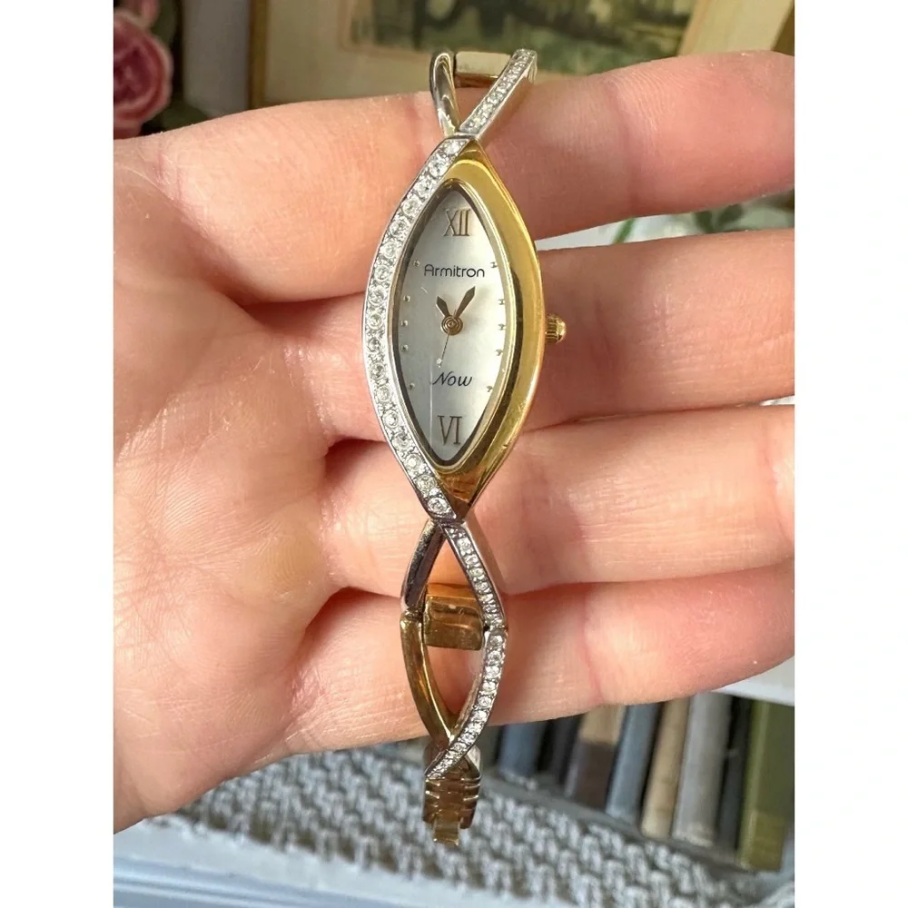 Armitron Now women's,gold-tone oval case with crystal accents and a two-tone